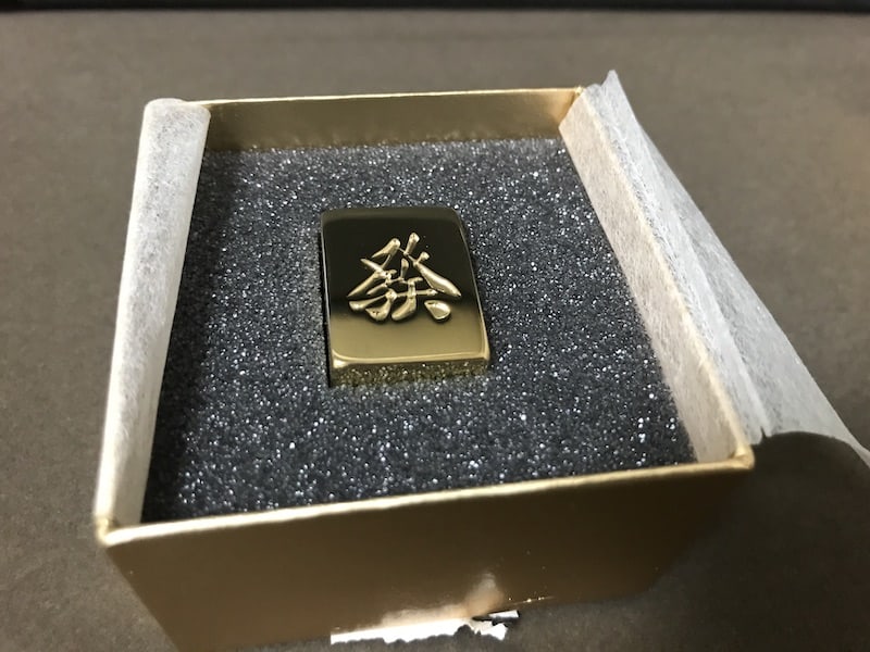 golden-mahjong-tile-in-case